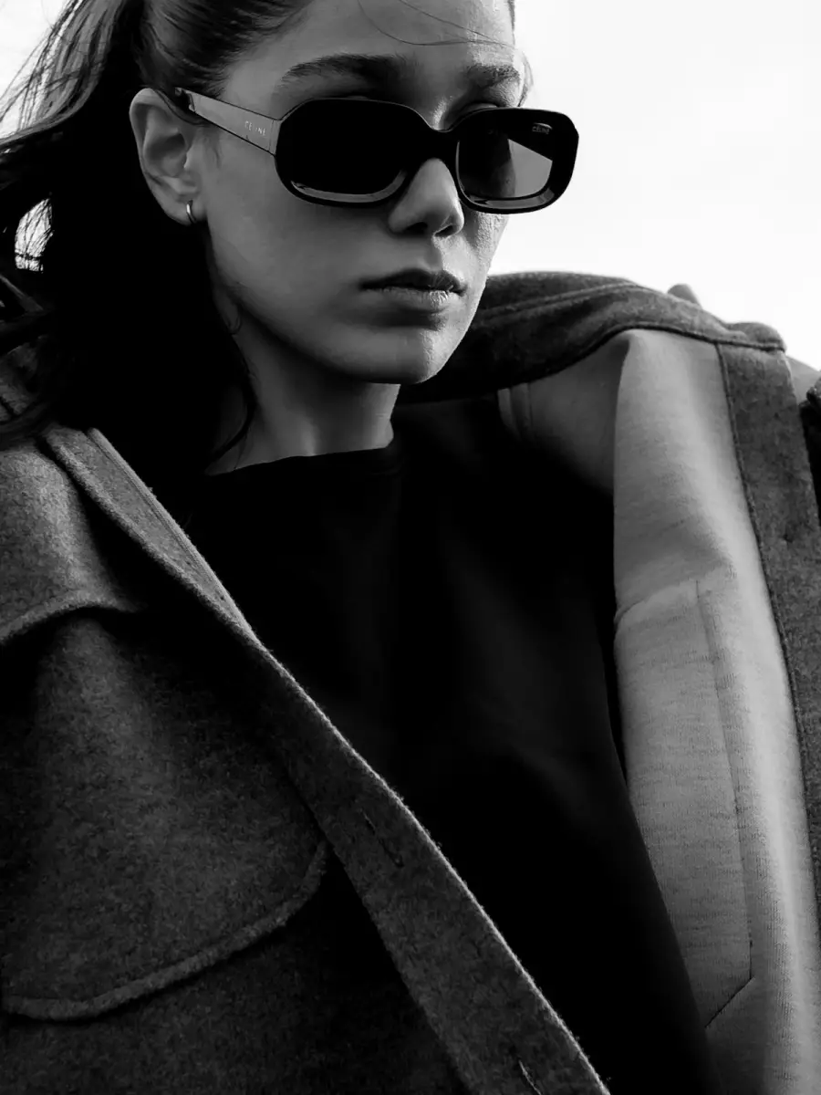 Model in sunglasses and a wool coat